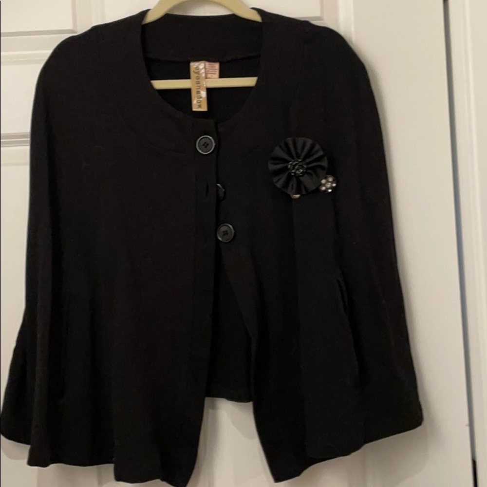 Cape with pockets